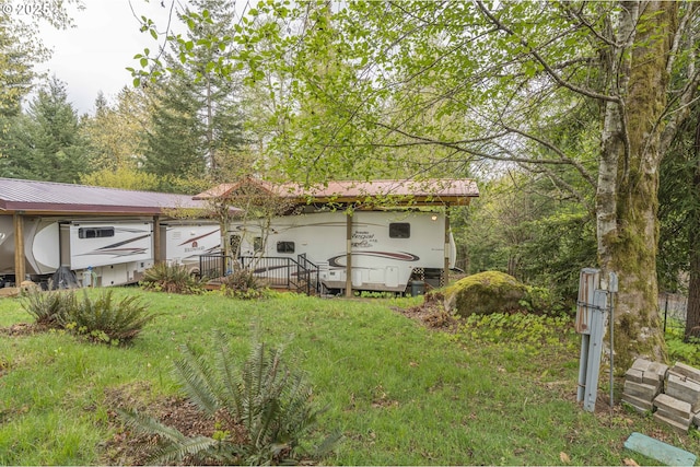 24706 NE Columbia Tie Rd Unit 41/21, Amboy, WA 98601 - rear view of house featuring a lawn and metal roof