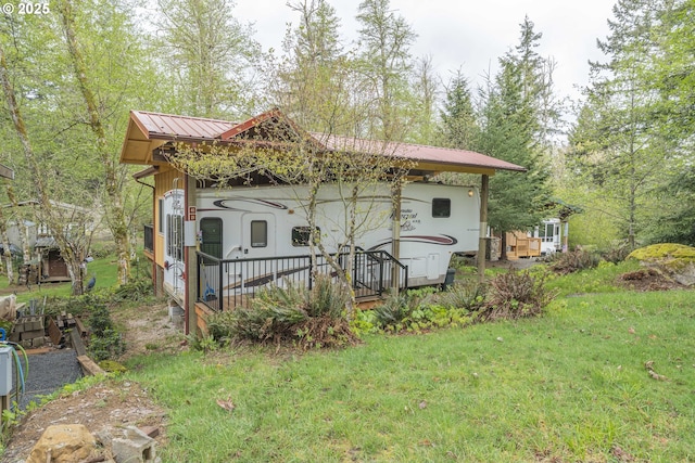 24706 NE Columbia Tie Rd Unit 41/21, Amboy, WA 98601 - exterior space featuring a lawn and metal roof