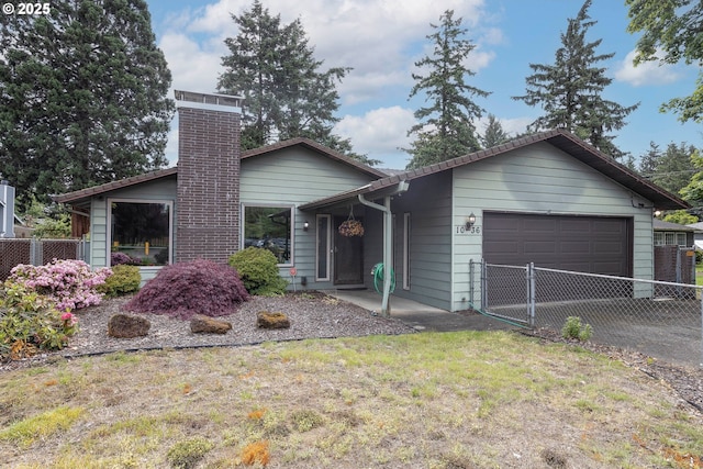 1036 SE 135th Ave, Portland, OR 97233 - ranch-style house featuring an attached garage, a chimney, and asphalt driveway