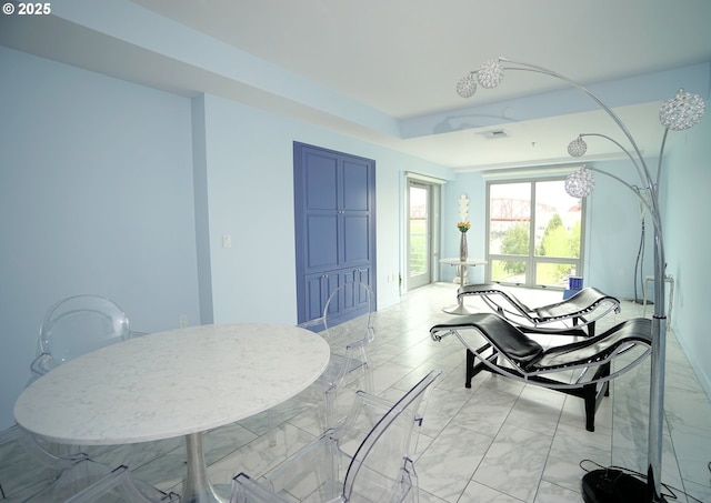 1260 NW Naito Pkwy Unit 604B, Portland, OR 97209 - dining space featuring marble finish floor and visible vents