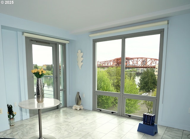 1260 NW Naito Pkwy Unit 604B, Portland, OR 97209 - entryway with a healthy amount of sunlight and marble finish floor