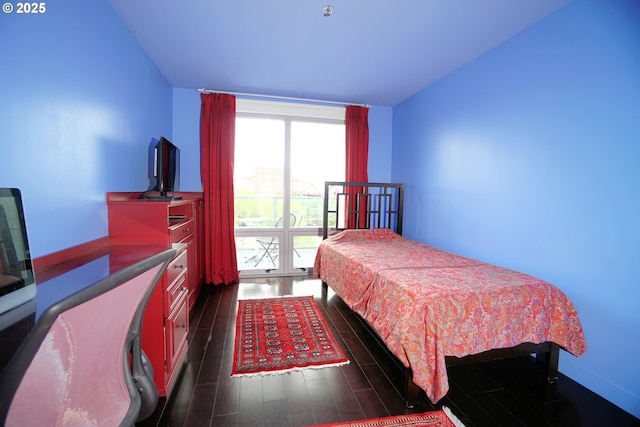 1260 NW Naito Pkwy Unit 604B, Portland, OR 97209 - bedroom with dark wood-style flooring