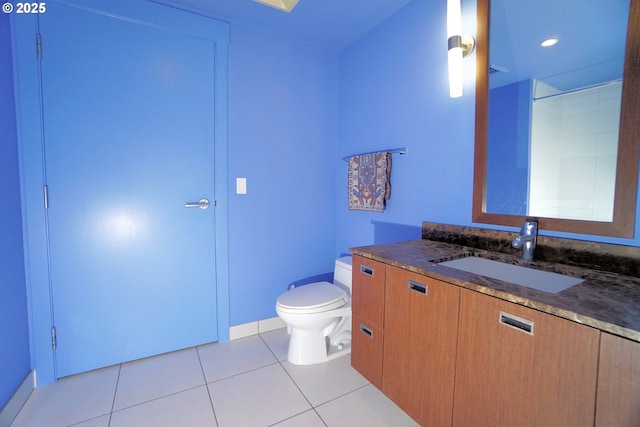 1260 NW Naito Pkwy Unit 604B, Portland, OR 97209 - full bathroom featuring tile patterned floors, baseboards, vanity, and toilet