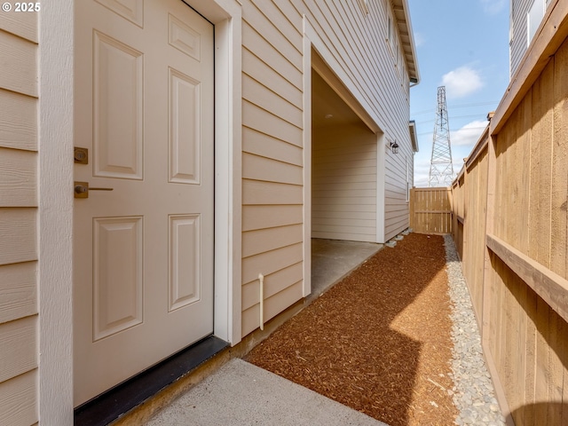view of side of property featuring fence