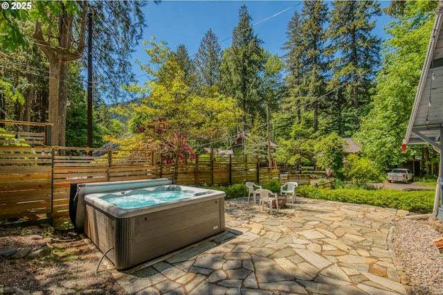 26630 E Roberts Rd, Welches, OR 97067 - fenced backyard with a hot tub and a patio area