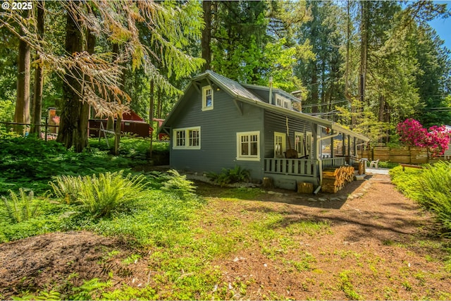 26630 E Roberts Rd, Welches, OR 97067 - view of side of home featuring metal roof and a deck