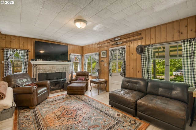 26630 E Roberts Rd, Welches, OR 97067 - living area with wood walls, wood finished floors, and a fireplace