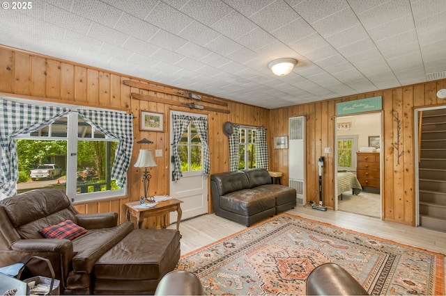 26630 E Roberts Rd, Welches, OR 97067 - living area featuring plenty of natural light, wood walls, and wood finished floors