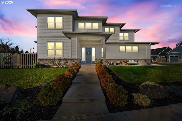 view of front of home with a lawn