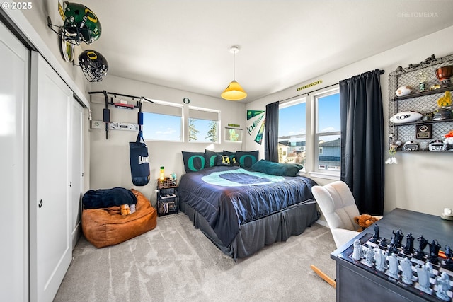 carpeted bedroom featuring a closet