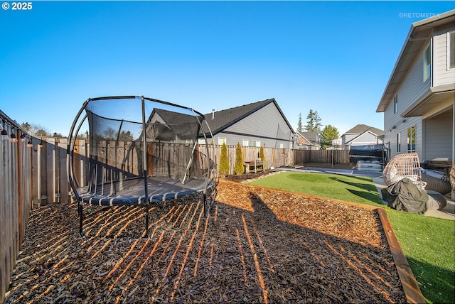 view of yard with a trampoline