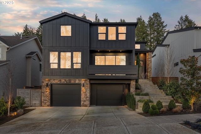 view of front of home with elevator and a garage