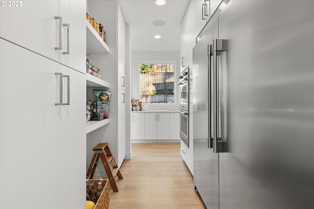 corridor featuring light hardwood / wood-style flooring