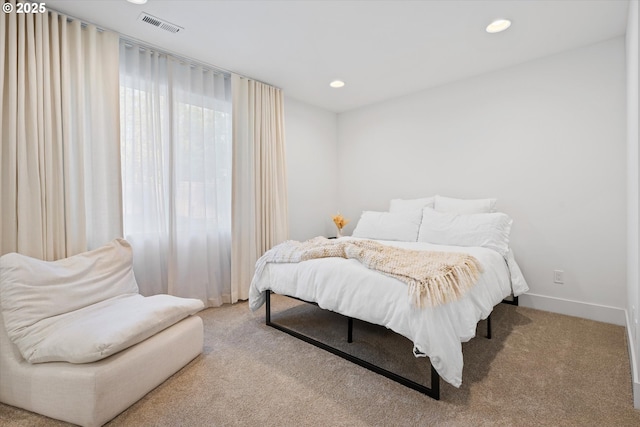 bedroom with light carpet