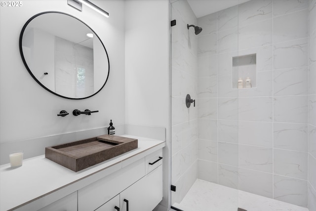 bathroom featuring an enclosed shower and vanity