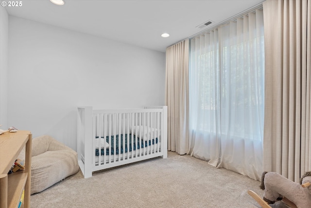 bedroom with light colored carpet