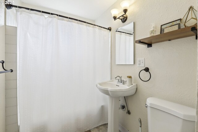 545 N St, Castle Rock, WA 98611 - bathroom with toilet, a shower with curtain, and a sink