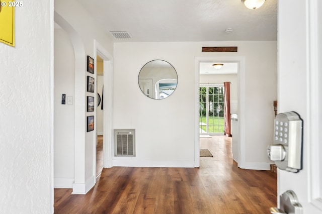 545 N St, Castle Rock, WA 98611 - corridor with baseboards, arched walkways, and wood finished floors
