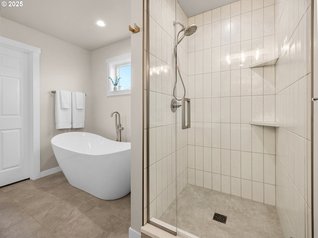 35692 Bella Ridge Loop, Astoria, OR 97103 - bathroom with a freestanding tub, baseboards, and a stall shower