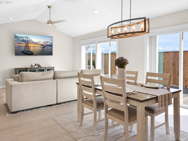 35692 Bella Ridge Loop, Astoria, OR 97103 - dining space with lofted ceiling, light wood-style flooring, recessed lighting, and ceiling fan with notable chandelier