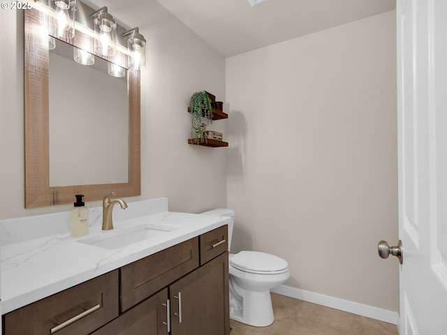 35692 Bella Ridge Loop, Astoria, OR 97103 - bathroom featuring toilet, vanity, tile patterned floors, and baseboards