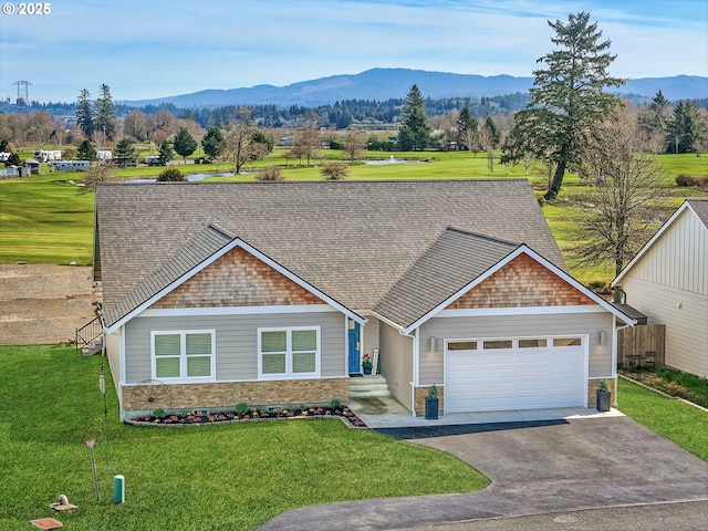 35692 Bella Ridge Loop, Astoria, OR 97103 - view of front of home with driveway, a front yard, a garage, and a mountain view