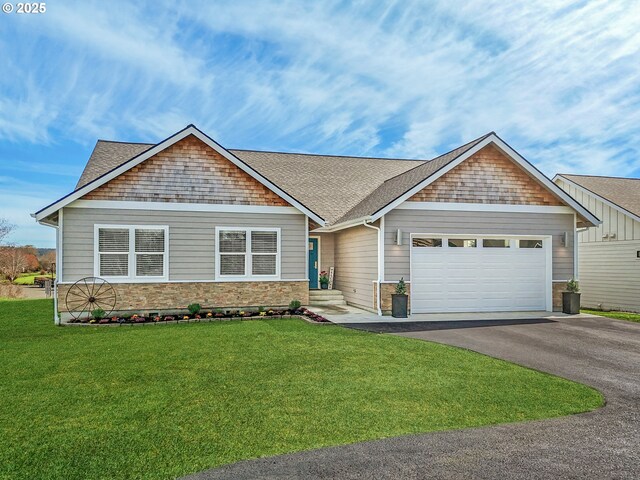 35692 Bella Ridge Loop, Astoria, OR 97103 - craftsman inspired home featuring roof with shingles, an attached garage, stone siding, aphalt driveway, and a front lawn
