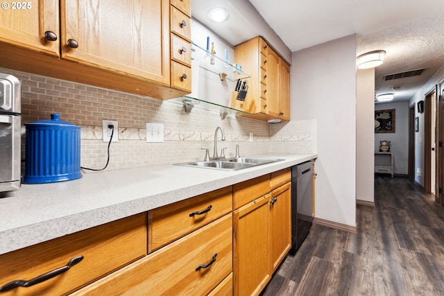 8312 SW Tygh Loop, Tualatin, OR 97062 - kitchen with a sink, dark wood finished floors, dishwasher, light countertops, and decorative backsplash