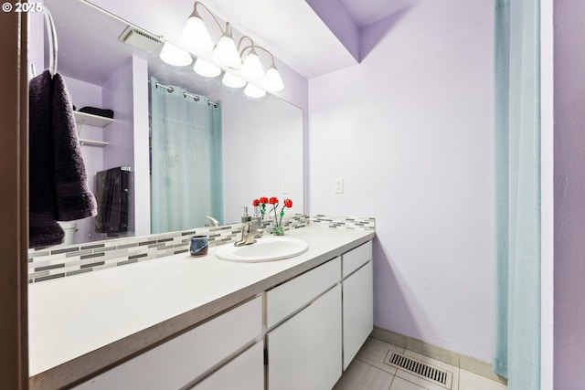 8312 SW Tygh Loop, Tualatin, OR 97062 - full bathroom featuring vanity, tile patterned flooring, and backsplash