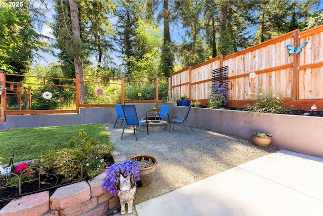 8312 SW Tygh Loop, Tualatin, OR 97062 - view of patio / terrace featuring an outdoor fire pit