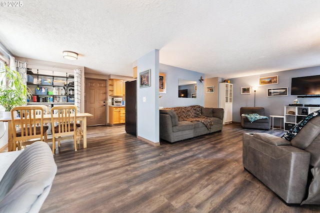 8312 SW Tygh Loop, Tualatin, OR 97062 - living room featuring dark wood finished floors, a textured ceiling, and baseboards