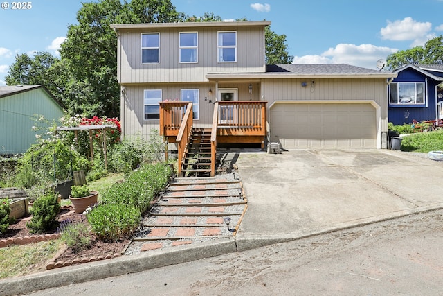 284 N 17th St, Saint Helens, OR 97051 - view of front of house featuring stairway, an attached garage, and driveway
