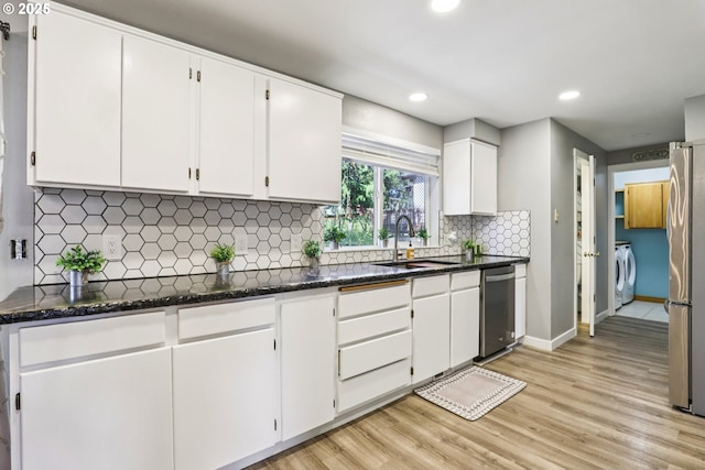 284 N 17th St, Saint Helens, OR 97051 - kitchen with appliances with stainless steel finishes, separate washer and dryer, light wood-type flooring, white cabinets, and recessed lighting