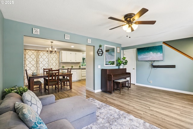 284 N 17th St, Saint Helens, OR 97051 - living area with a chandelier, light wood finished floors, and a ceiling fan