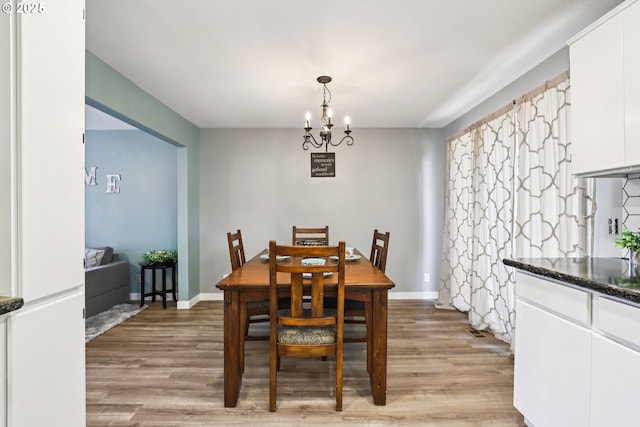 284 N 17th St, Saint Helens, OR 97051 - dining space featuring a chandelier and light wood-style floors