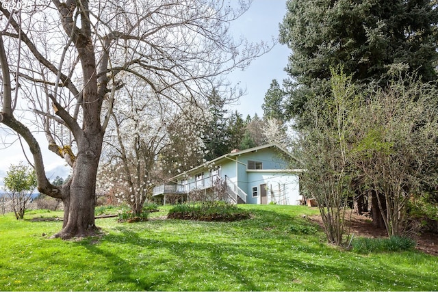 view of yard with stairway and a garage