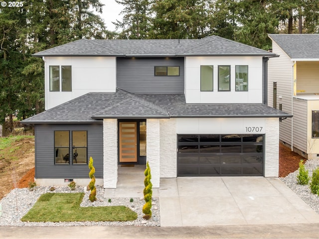 view of front of property featuring crawl space, concrete driveway, a garage, and a shingled roof