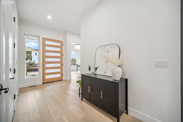 entryway featuring visible vents, recessed lighting, baseboards, and light wood-type flooring