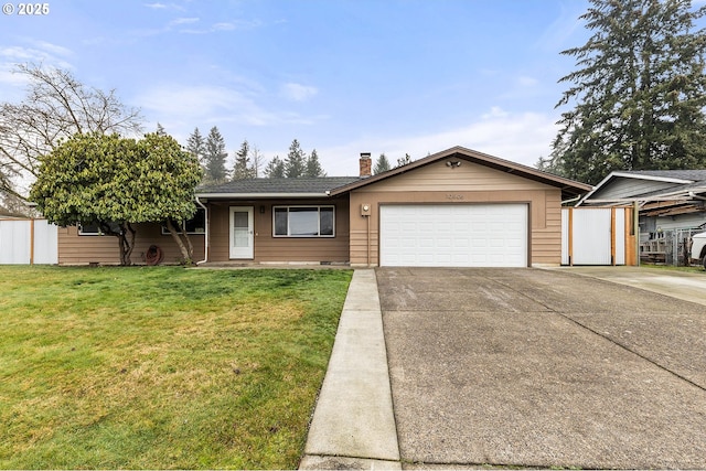 ranch-style house with a garage and a front lawn