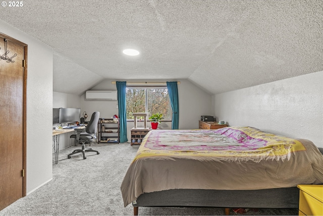 bedroom featuring lofted ceiling, a textured ceiling, carpet, and a wall unit AC