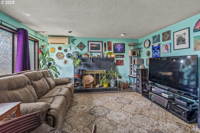 living room with a fireplace, an AC wall unit, and a textured ceiling