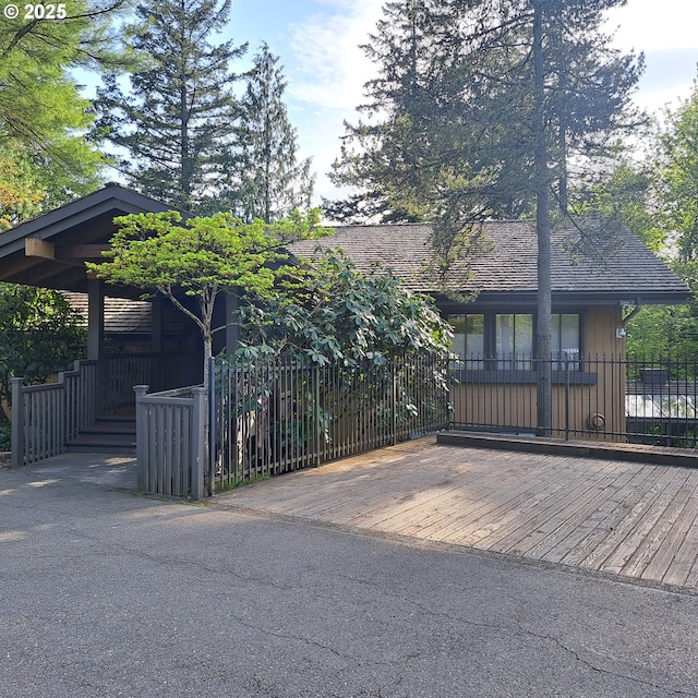 view of home's exterior featuring fence