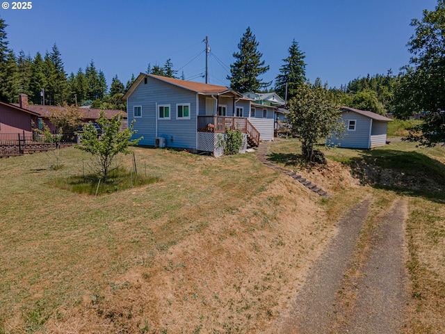 1446 N Collier St, Coquille, OR 97423 - view of yard with dirt driveway and a wooden deck