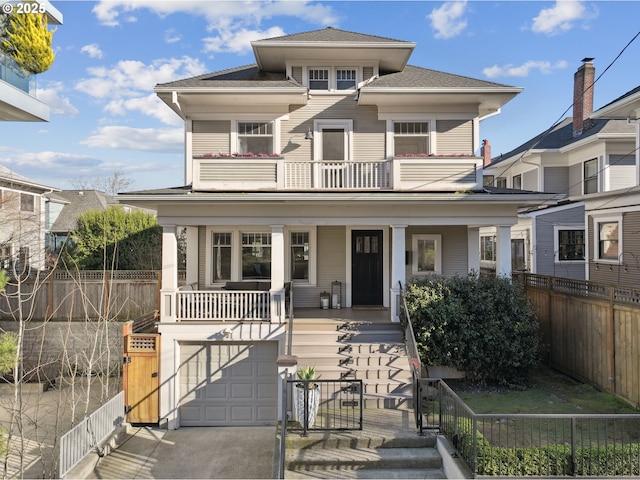 view of front of home with a balcony, a garage, and covered porch