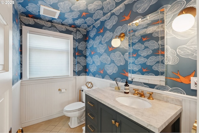 bathroom with vanity, tile patterned floors, and toilet