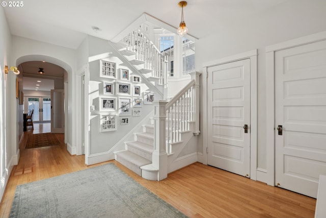 stairs with hardwood / wood-style floors