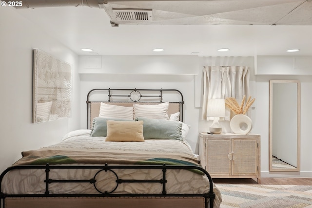 bedroom with wood-type flooring