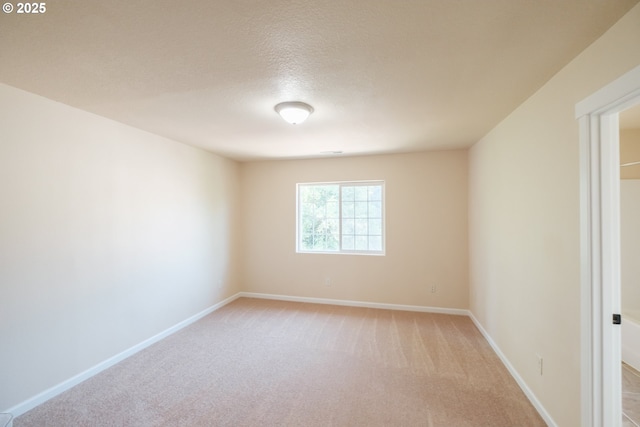 14146 Brittany Ter, Oregon City, OR 97045 - spare room with light carpet, baseboards, and a textured ceiling