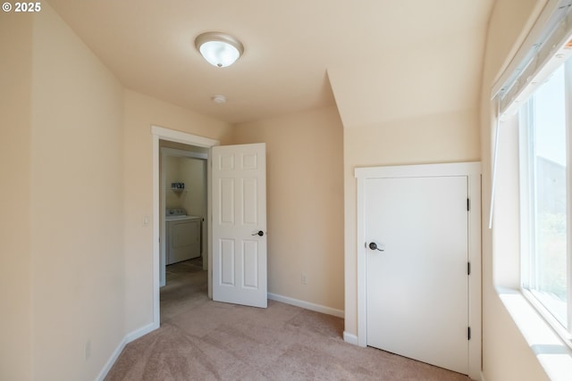 14146 Brittany Ter, Oregon City, OR 97045 - unfurnished bedroom with light carpet, baseboards, and separate washer and dryer