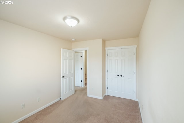 14146 Brittany Ter, Oregon City, OR 97045 - unfurnished bedroom featuring light colored carpet, baseboards, and a closet